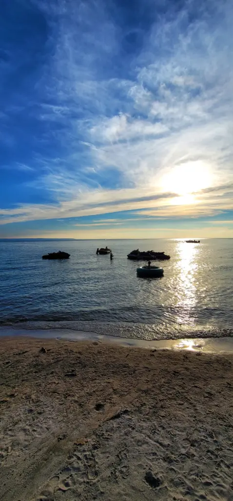 Serene golden sunset over the water, reflecting the CARI event experience.