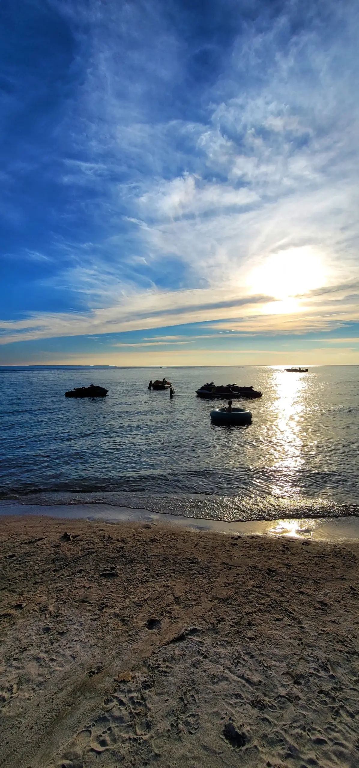 Serene golden sunset over the water, reflecting the CARI event experience.