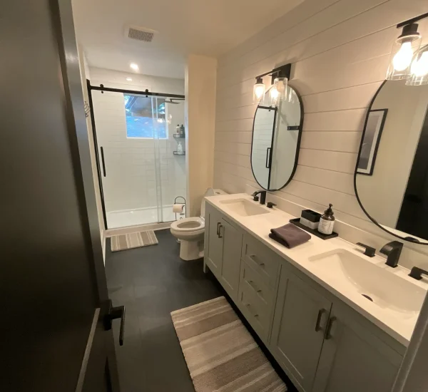 Modern bathroom with double vanity in CARI private resort accommodations