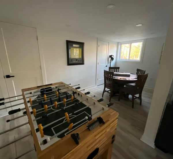 Indoor recreation and dining space with foosball table at CARI private resort for group retreats